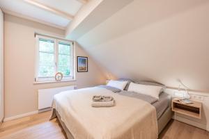 Ένα ή περισσότερα κρεβάτια σε δωμάτιο στο Ferienhaus Herrlich 01 Feriendorf Klein Stresow Rügen by ruyastay