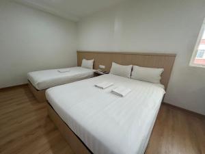 Katil atau katil-katil dalam bilik di Mint Hotel
