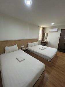 Katil atau katil-katil dalam bilik di Mint Hotel