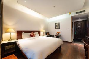Postelja oz. postelje v sobi nastanitve Ha Noi Memory Central Hotel And Spa