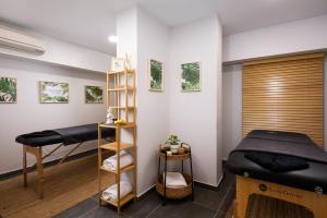 a bedroom with two beds and a bunk bed at Athenian Riviera Hotel& Suites in Athens