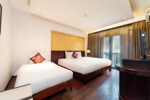 Postelja oz. postelje v sobi nastanitve Ha Noi Memory Central Hotel And Spa