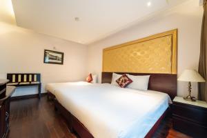 Postelja oz. postelje v sobi nastanitve Ha Noi Memory Central Hotel And Spa