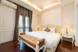 Postel nebo postele na pokoji v ubytování Ha Noi Memory Central Hotel And Spa