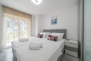 Postel nebo postele na pokoji v ubytování Villa Nina + 37 fotografií