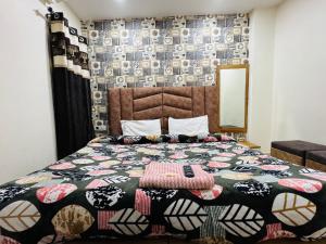 Postel nebo postele na pokoji v ubytování Hotel Divine inn