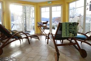 Posezení v ubytování B&B Apart Hotel Goldener Hahn - nahe an Gartenschau Tal X