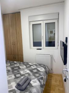 Postel nebo postele na pokoji v ubytování Apartman Filip