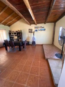 a large living room with a table and chairs at casa cepeda in Colón