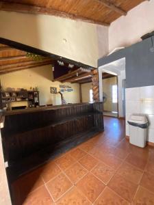 a kitchen with a counter and a toilet in a room at casa cepeda in Colón