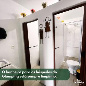 a bathroom with a shower and a sink at Glamping Pomerode in Pomerode
