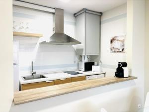 Η κουζίνα ή μικρή κουζίνα στο Apartamento El Rincón de Zuri +14 φωτογραφίες