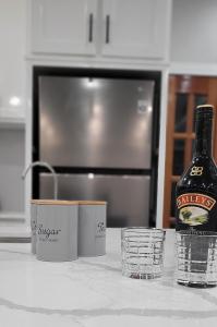 a bottle of beer sitting on top of a kitchen counter at The Royal Haven Herstelling GY in Nismes
