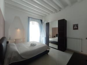 Postel nebo postele na pokoji v ubytování KiMia Home, Centro