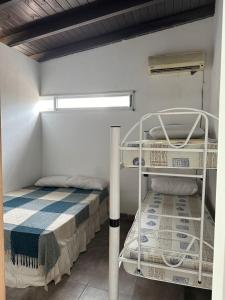 Ένα ή περισσότερα κρεβάτια σε δωμάτιο στο Casa con pileta en Fisherton Rosario