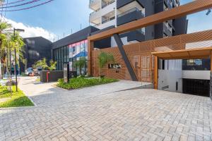 a brick driveway in front of a building at Hub Boa Vista by Viva - Prédio novo próximo ao Autódromo de Interlagos com lavanderia e academia in Sao Paulo +118 photos