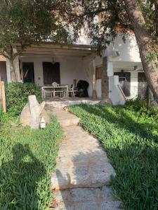 a stone path in front of a house at CASA TRIBOLATI SANTA REPARATA in Santa Reparata