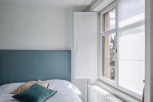 Postelja oz. postelje v sobi nastanitve Consum Boutique Hotel