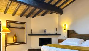 a bedroom with a bed and a fireplace at The Gem - Trastevere Cozy Retreat with pool in Rome