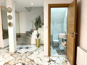 a bathroom with a toilet and a sink at Luxurious Triplex Carthage in Carthage