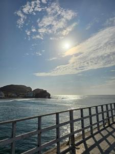 a view of the ocean from a pier at Hostal COSTA AZZURRA in Cerro Azul