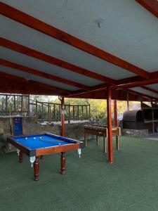 a pool table in a pavilion with at Hostal Panul in Panulcillo