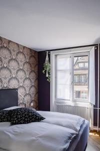 Postelja oz. postelje v sobi nastanitve Consum Boutique Hotel