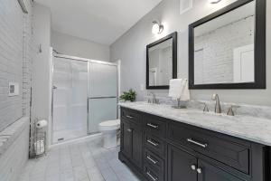 a bathroom with a sink and a toilet and a shower at Carytown Retreat Pet Friendly & Gourmet Kitchen in Richmond +19 photos