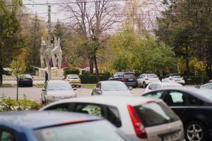 a parking lot filled with lots of parked cars at ONYX Apartament in Brăila