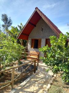a small house with a fence in front of it at Pousada Turmalina in Bueno Brandão +20 photos