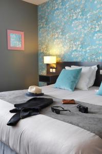 Postel nebo postele na pokoji v ubytování Altos Hotel & Spa