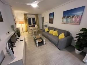 A television and/or entertainment centre at 2 Minutes From The Beach