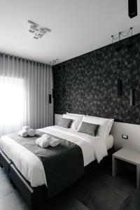 Letto o letti in una camera di B&B LUMAS