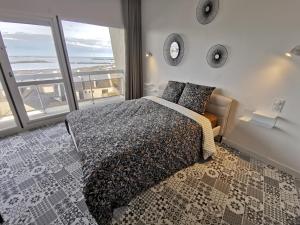 Postel nebo postele na pokoji v ubytování Studio vue mer roscoff et île de batz