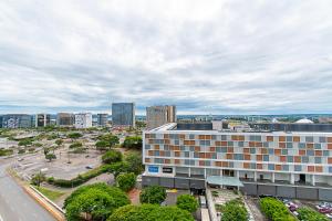an aerial view of a building in a city at Vision Hotel em Brasília 60613 in Brasília