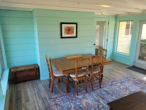 a dining room with a table and chairs at New! Hill Hideaway - Incredible Lakeviews! in Frankfort