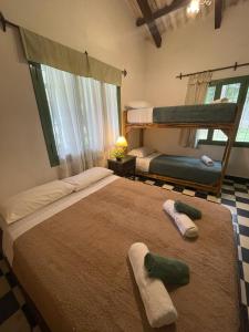 Postel nebo postele na pokoji v ubytování Madreselva Hostel