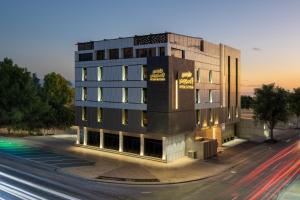 a building on a street next to a road at House Express in Tabuk