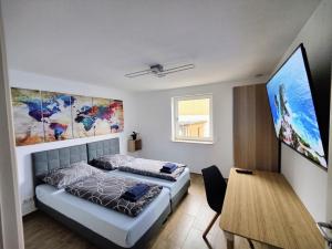 Ένα ή περισσότερα κρεβάτια σε δωμάτιο στο Schaefer Apartments - Haus Rote Warte
