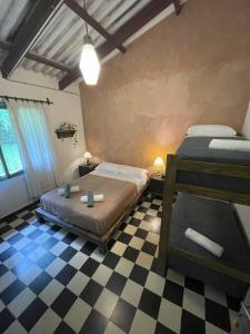 Postel nebo postele na pokoji v ubytování Madreselva Hostel