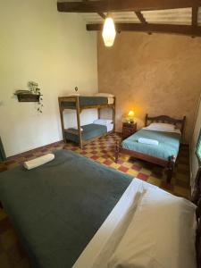 Postel nebo postele na pokoji v ubytování Madreselva Hostel