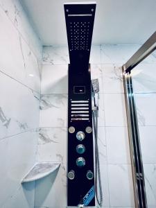 a shower in a bathroom with aaucet at New! Suite near Rittenhouse Square in Philadelphia +18 photos