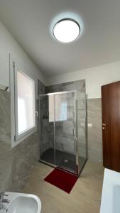 a bathroom with a glass shower and a sink at Casa Laguna Escape in Mestre +52 photos