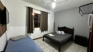 Cama ou camas em um quarto em Regi House Hostel