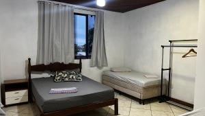 Cama ou camas em um quarto em Regi House Hostel