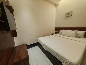 Postel nebo postele na pokoji v ubytování Citrine Hotel
