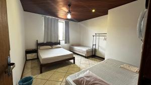 Cama ou camas em um quarto em Regi House Hostel