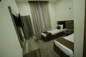Voodi või voodid majutusasutuse Mila HOTEL MAKKAH toas