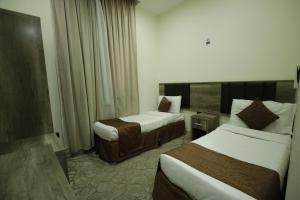 Voodi või voodid majutusasutuse Mila HOTEL MAKKAH toas