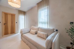 a living room with a couch and a window at lo͝or luxury retreat in Split